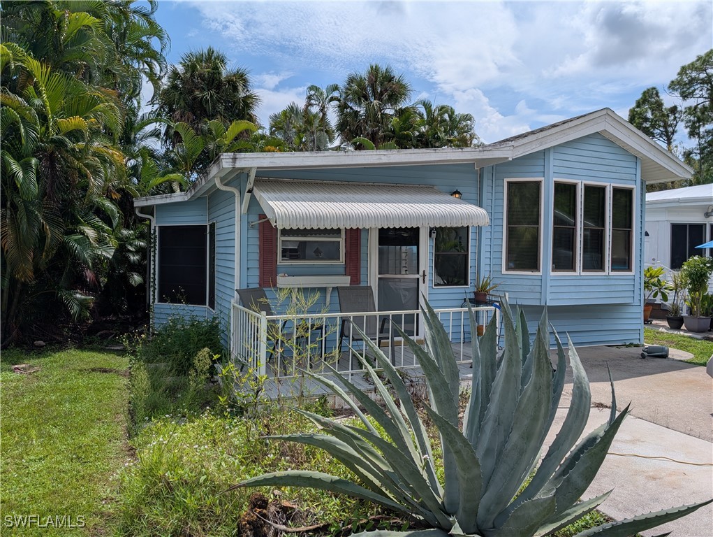 front view of a house with a garden