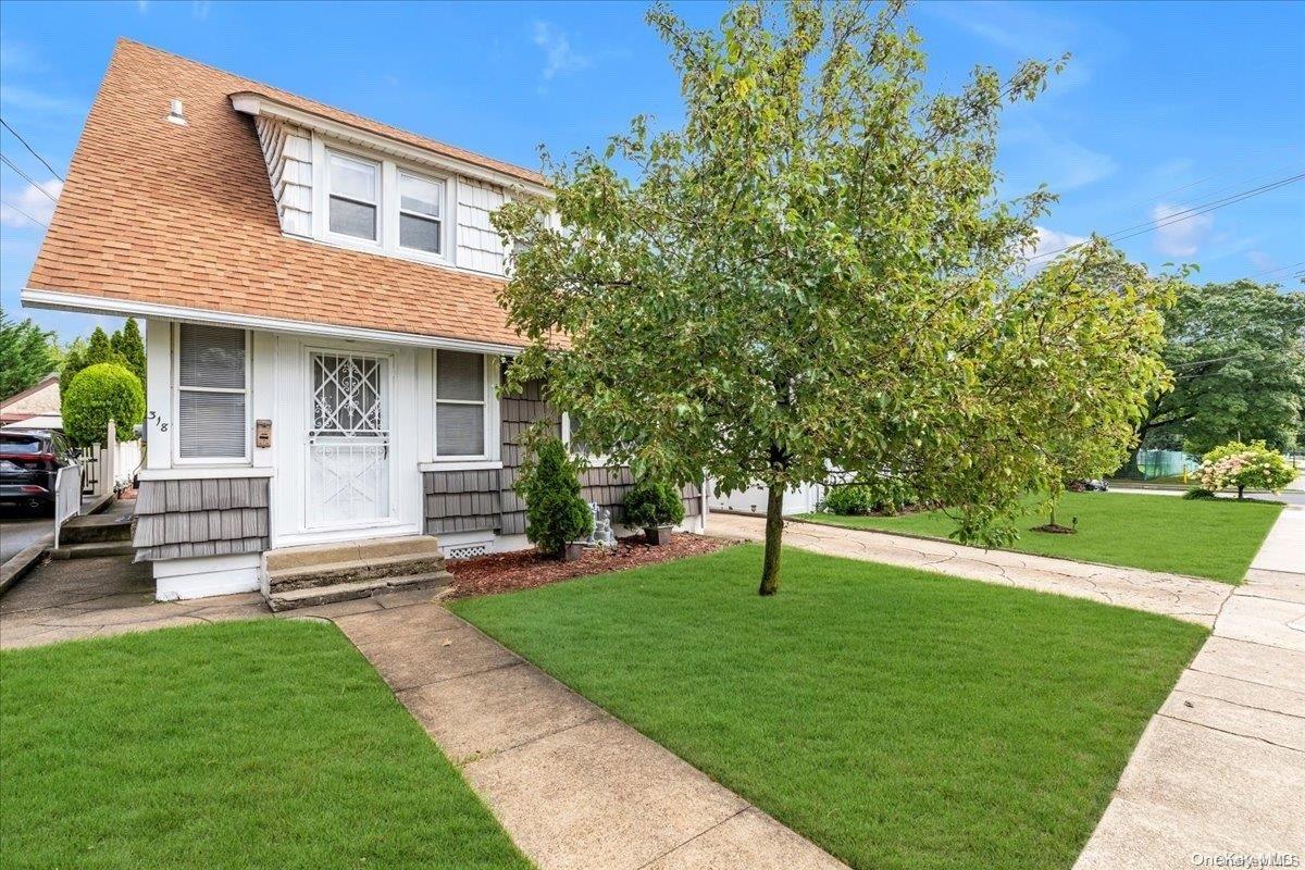 a front view of a house with a yard