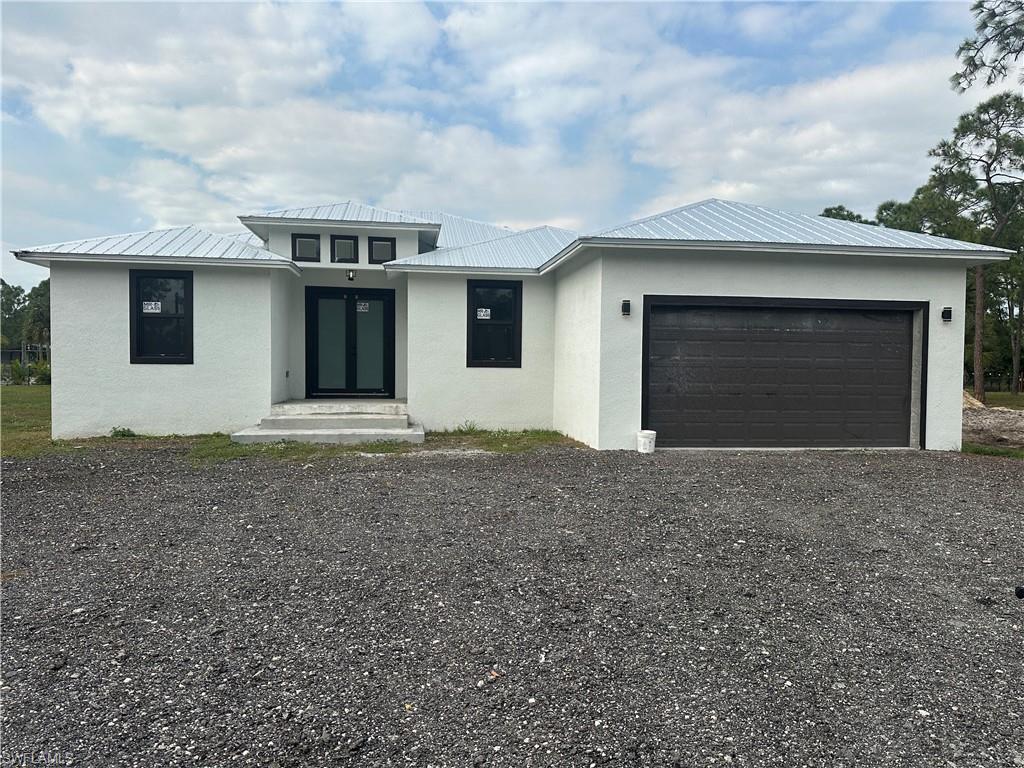 View of front of home with a garage