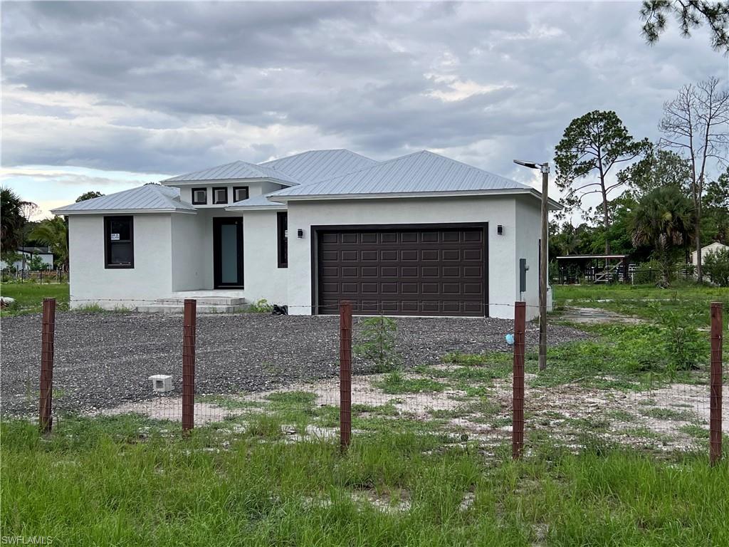 View of front of home featuring a garage