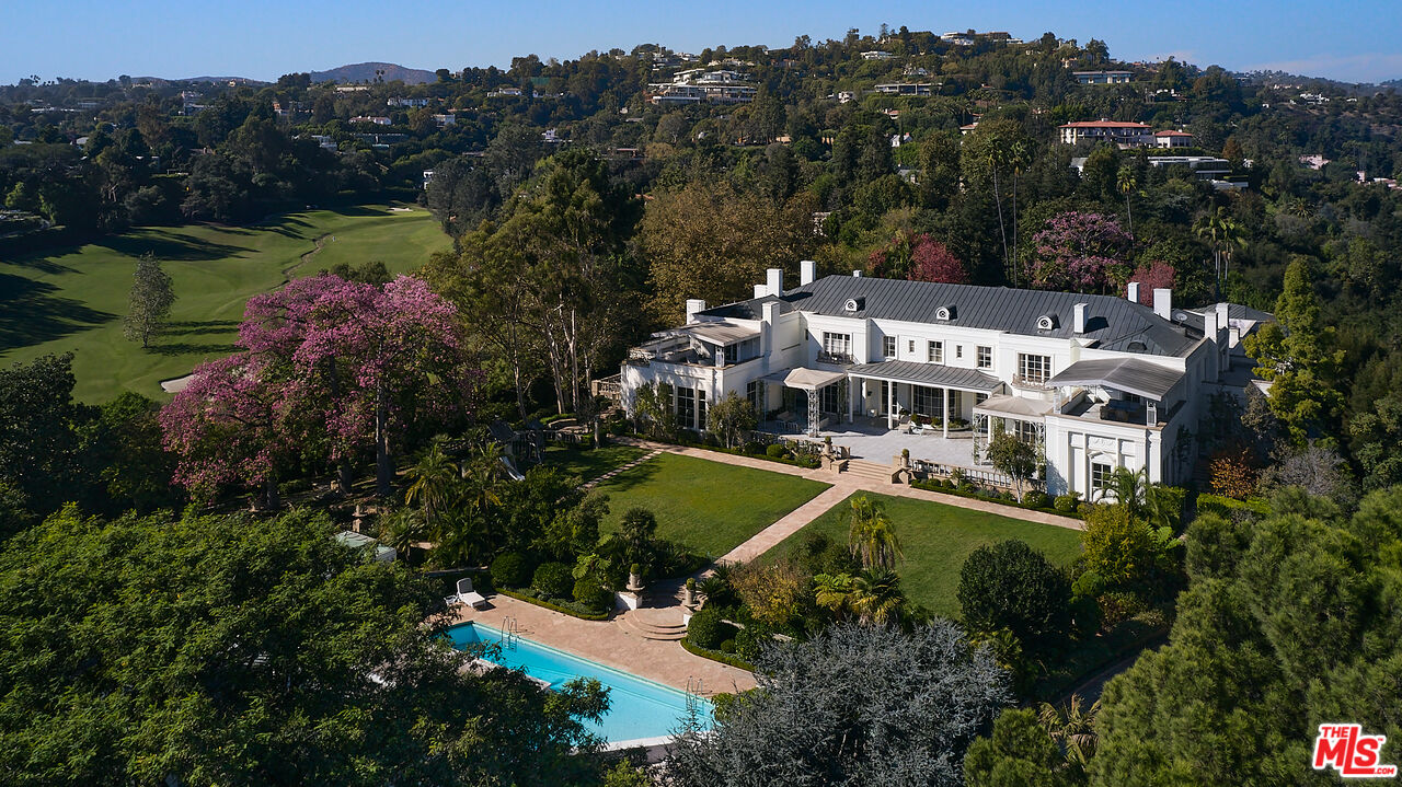 an aerial view of a house with a garden