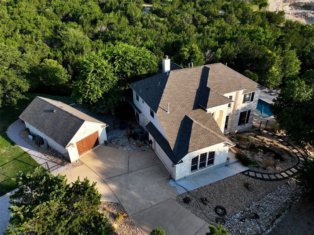 an aerial view of a house with a yard