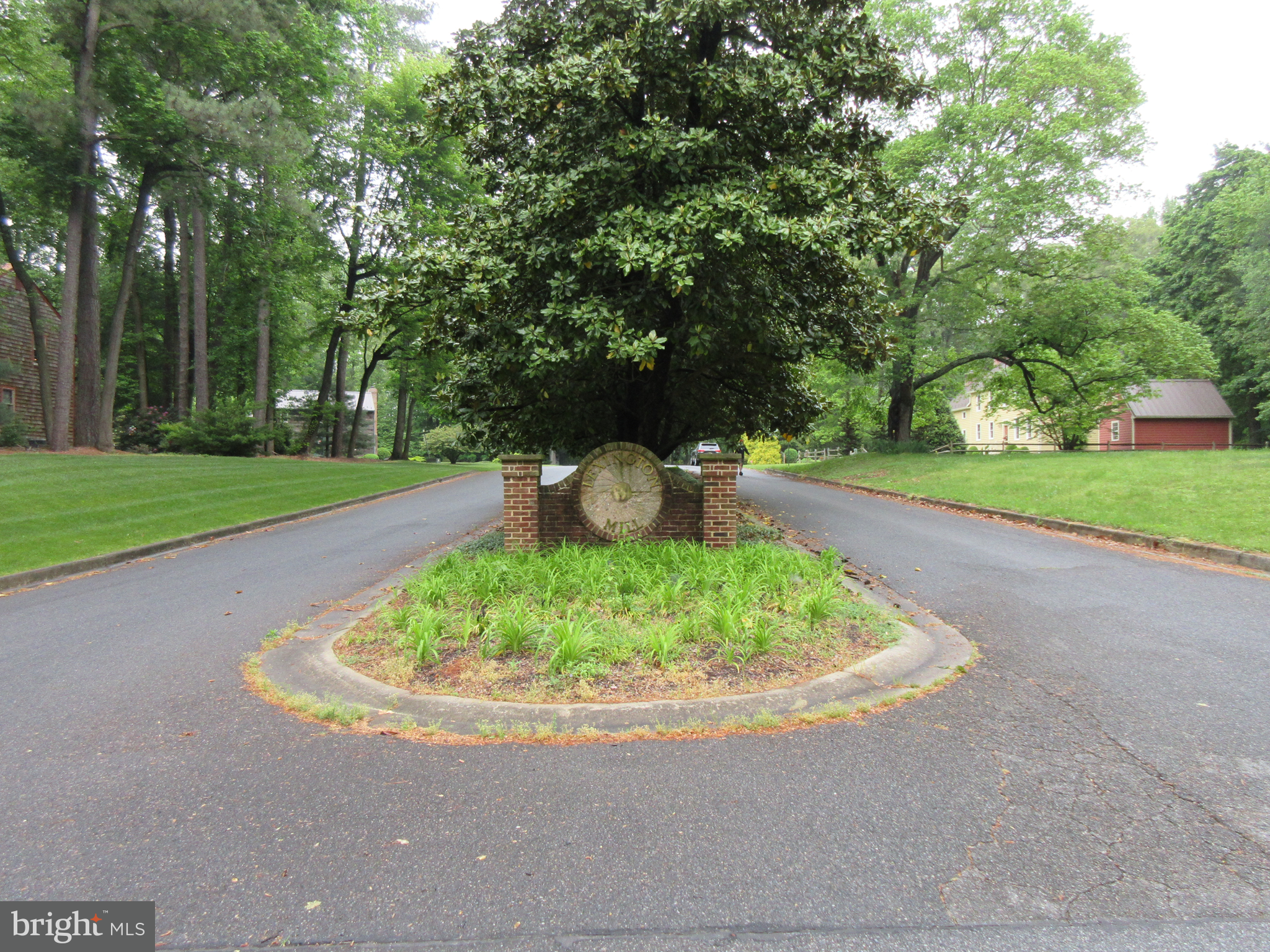 a view of a small yard with a trampoline