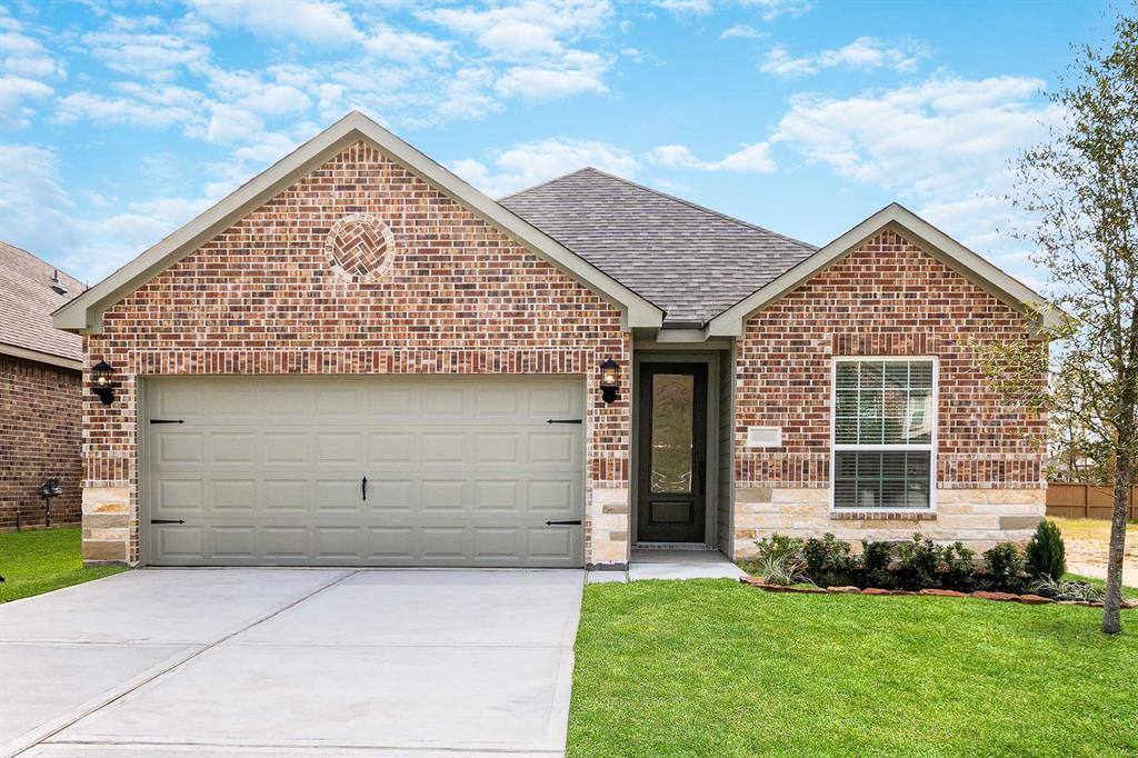 front view of a house with a yard