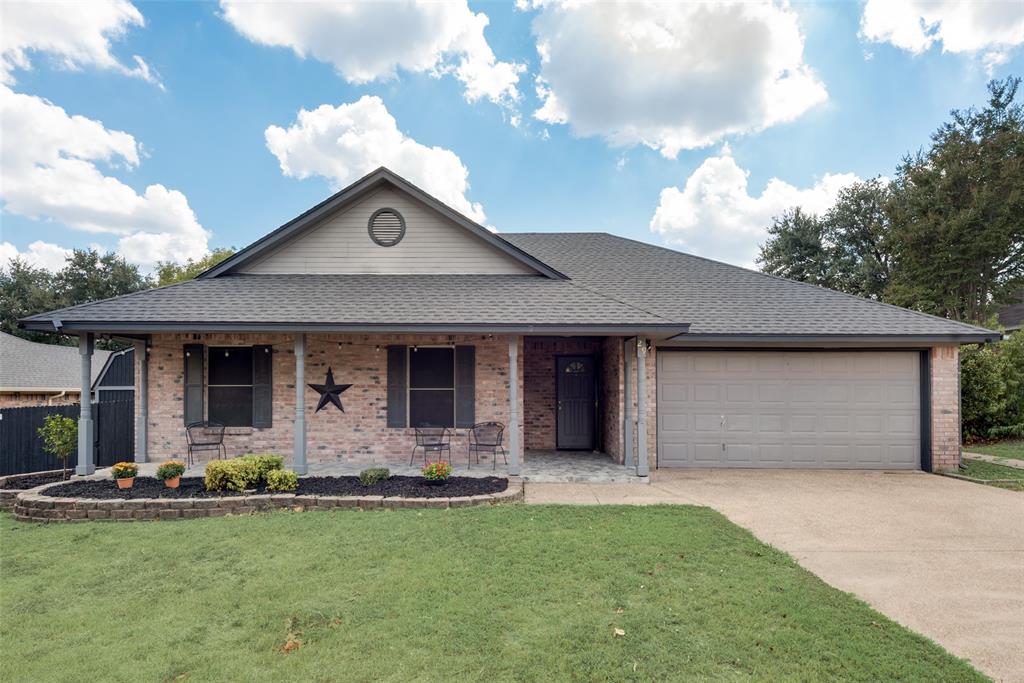 a front view of house with yard and outdoor seating