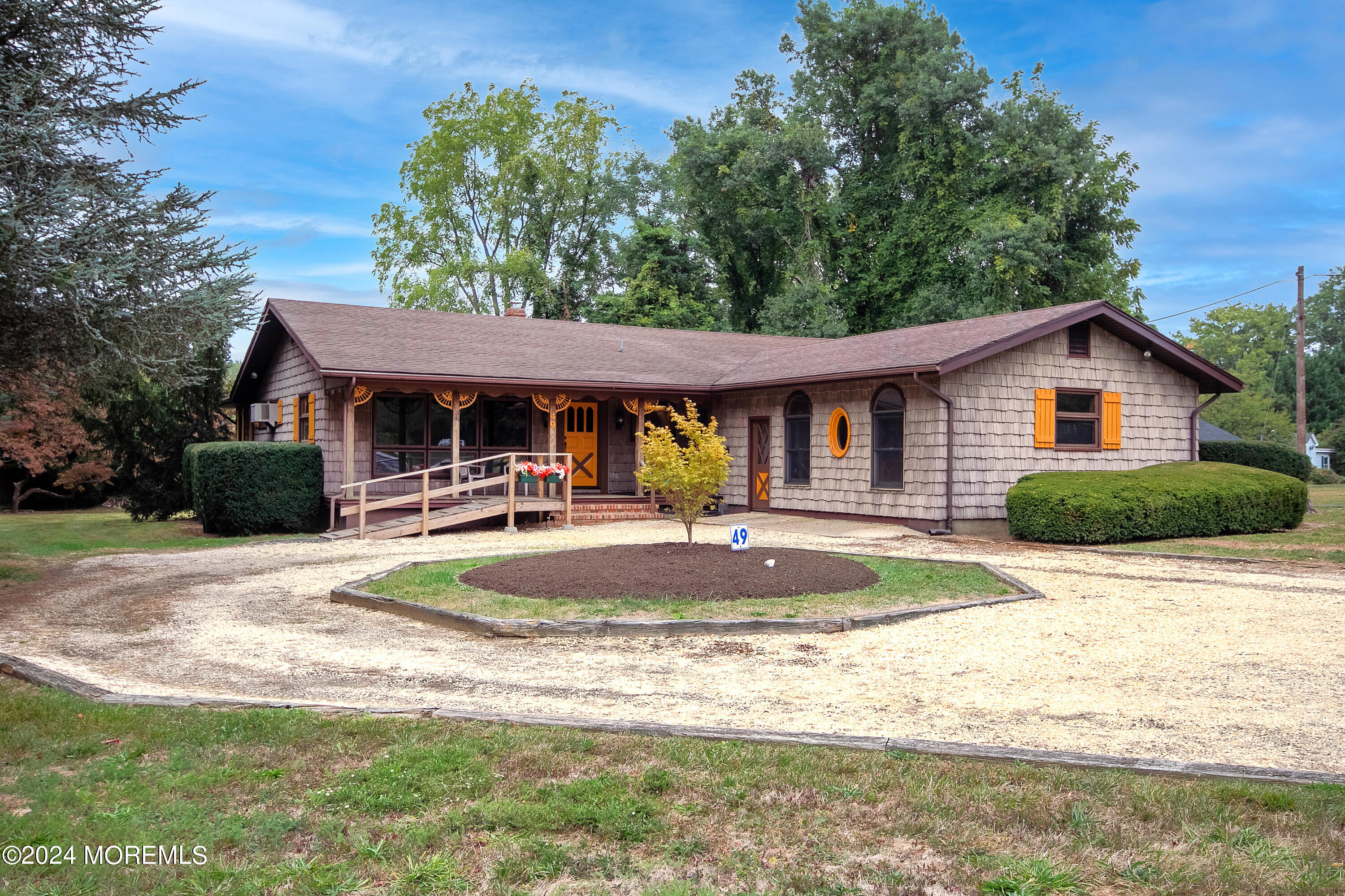 a front view of a house with garden