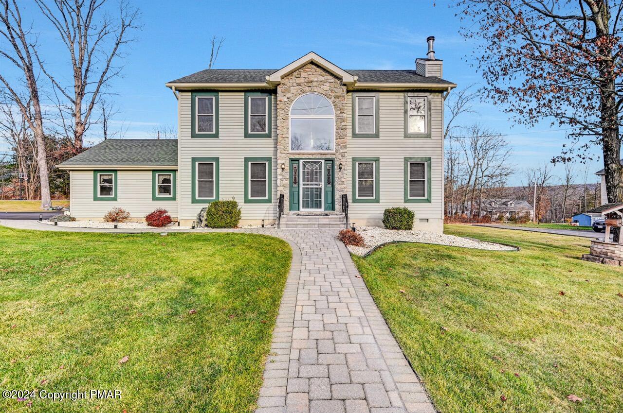 a front view of a house with garden