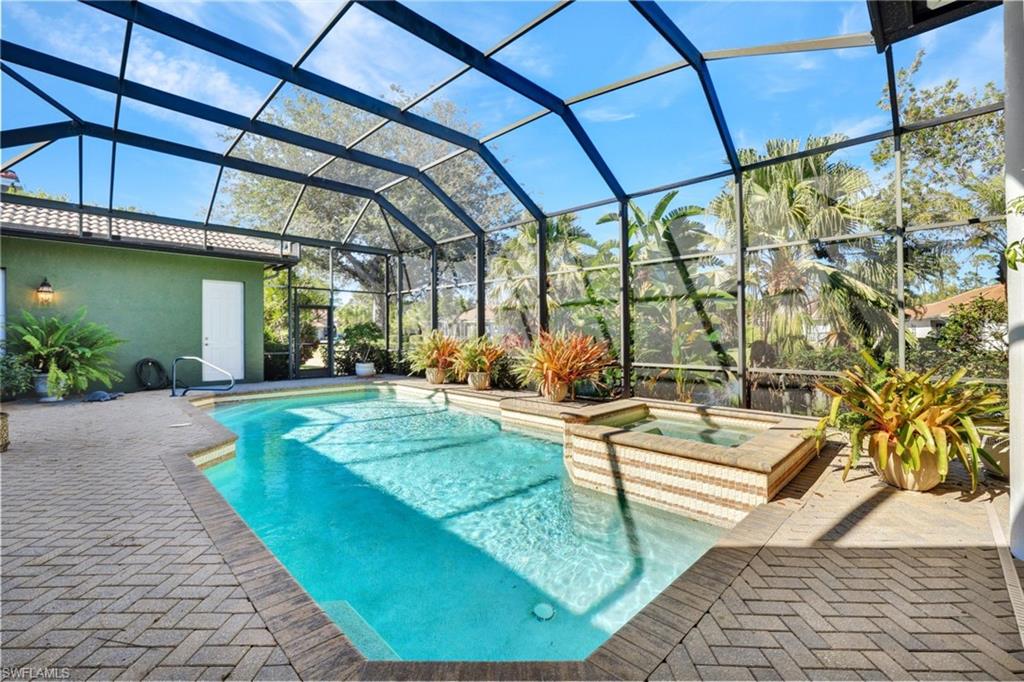 a view of a swimming pool with a patio