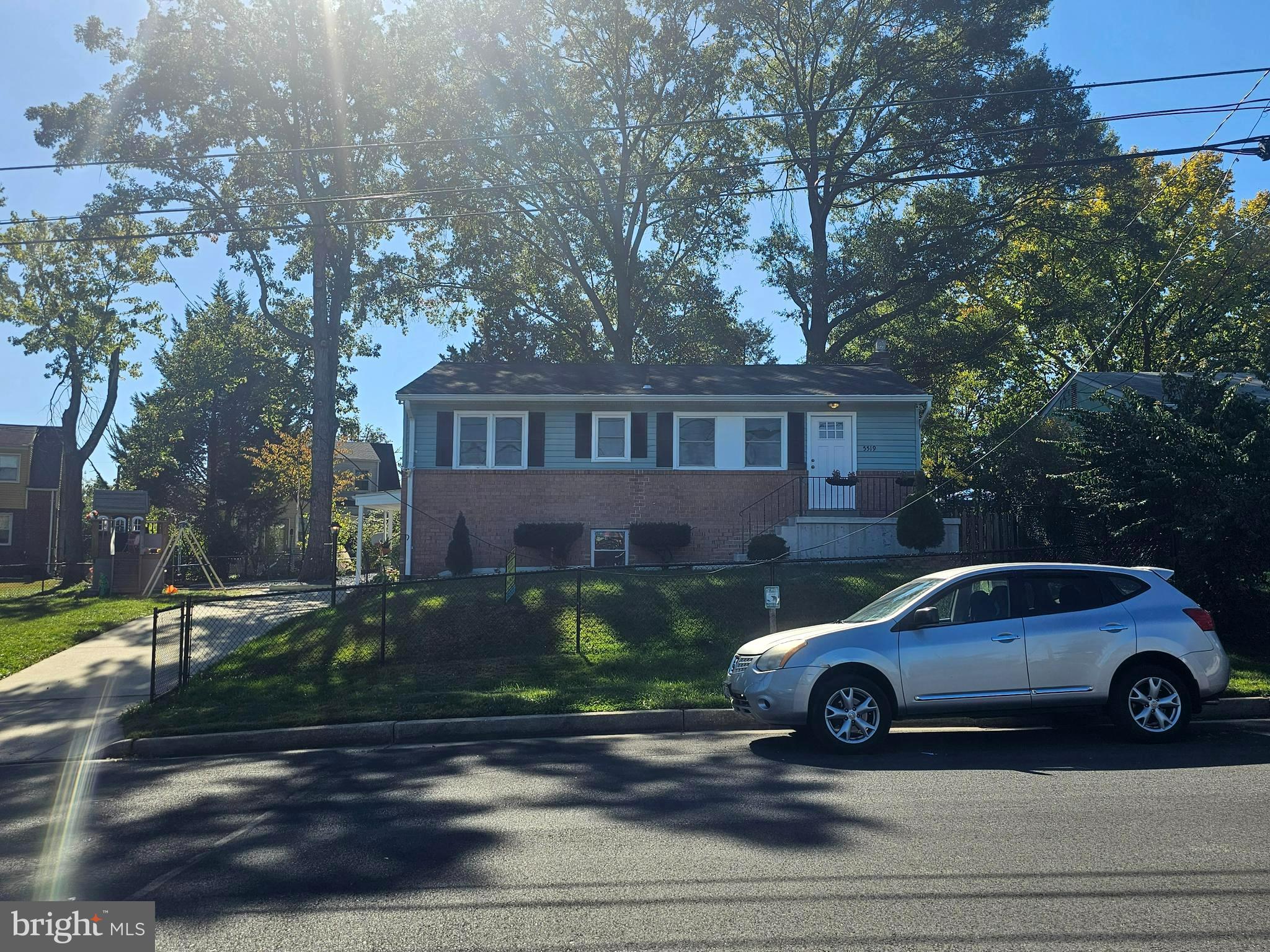 a view of a car parked in front of a house