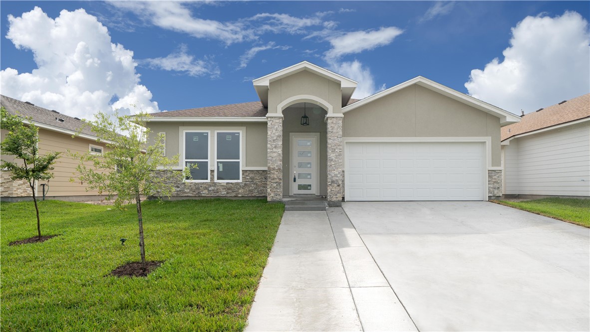 a front view of house with a yard