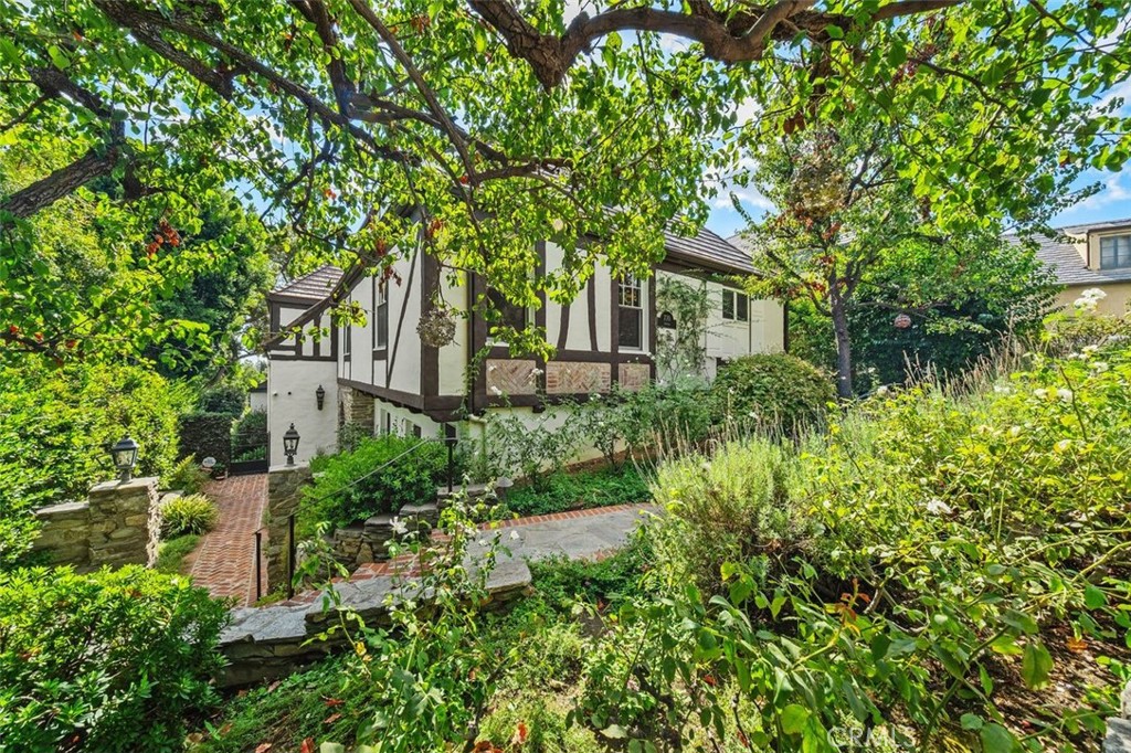 front view of a house with a tree