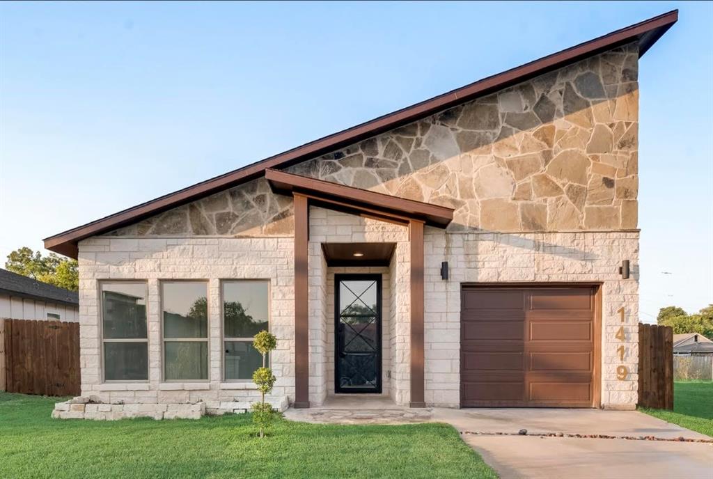 front view of a house with a yard