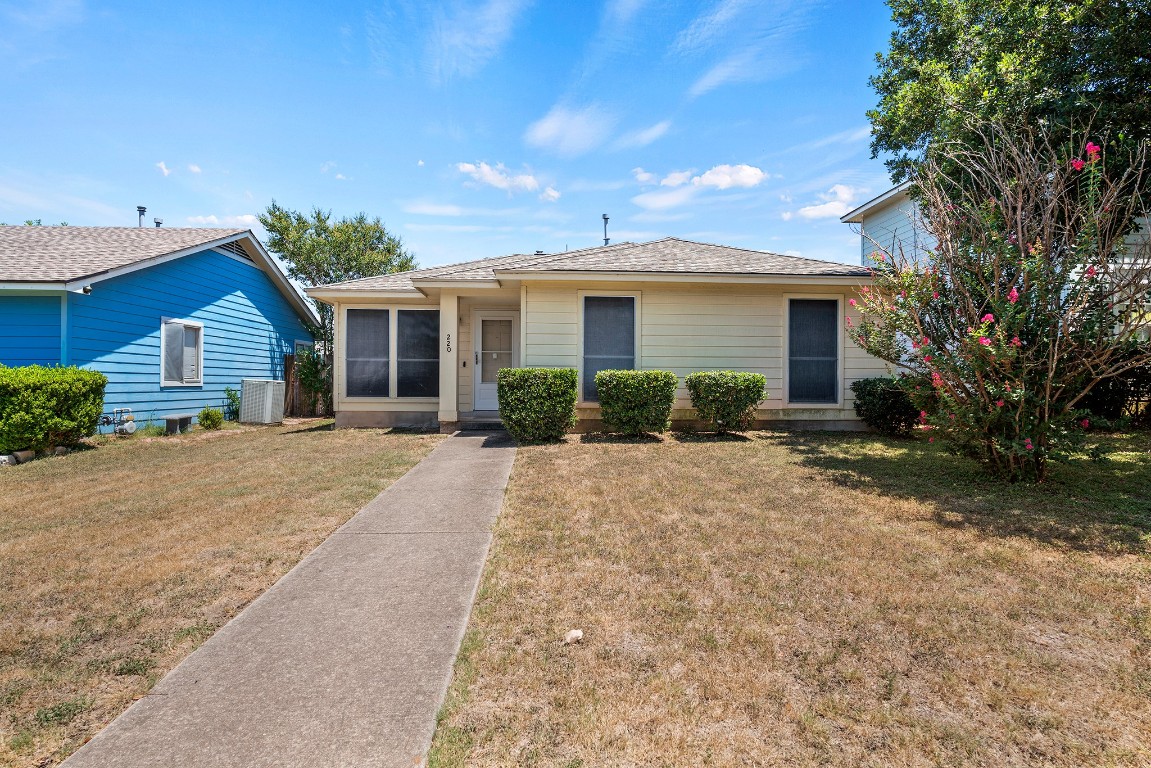 front view of a house with a yard