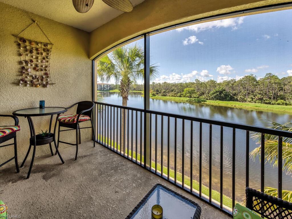 a view of a chairs and table in the balcony