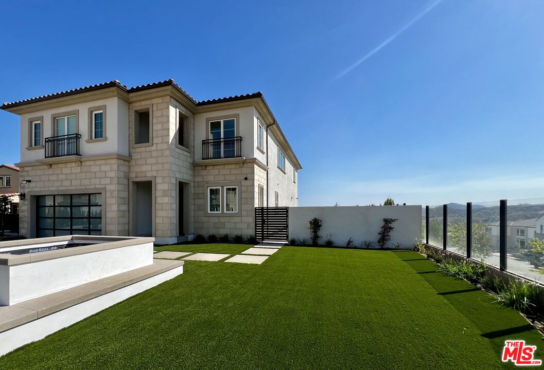 a view of a house with a yard and plants