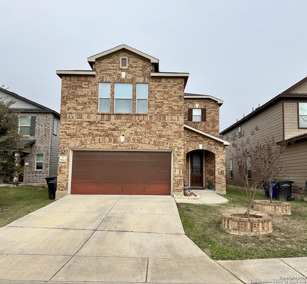 a front view of a house with yard