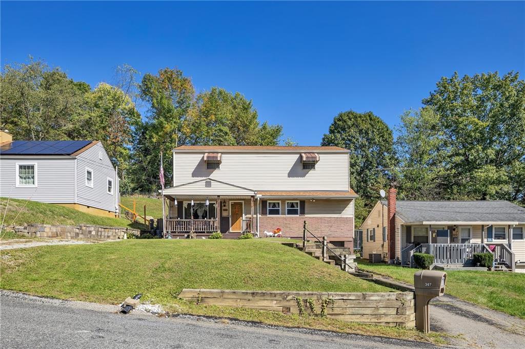 front view of a house with a yard