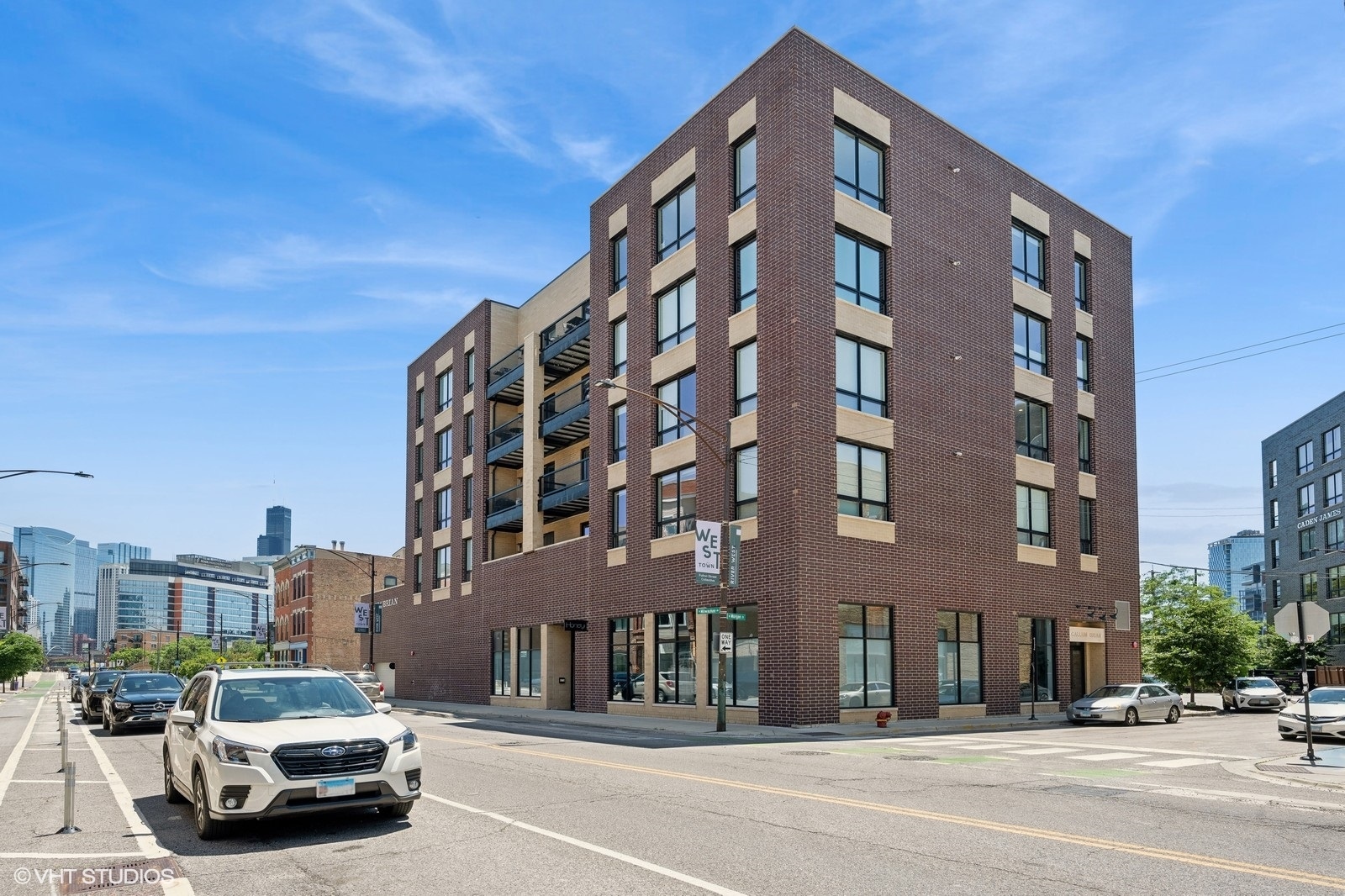 a view of a car parked in front of a building