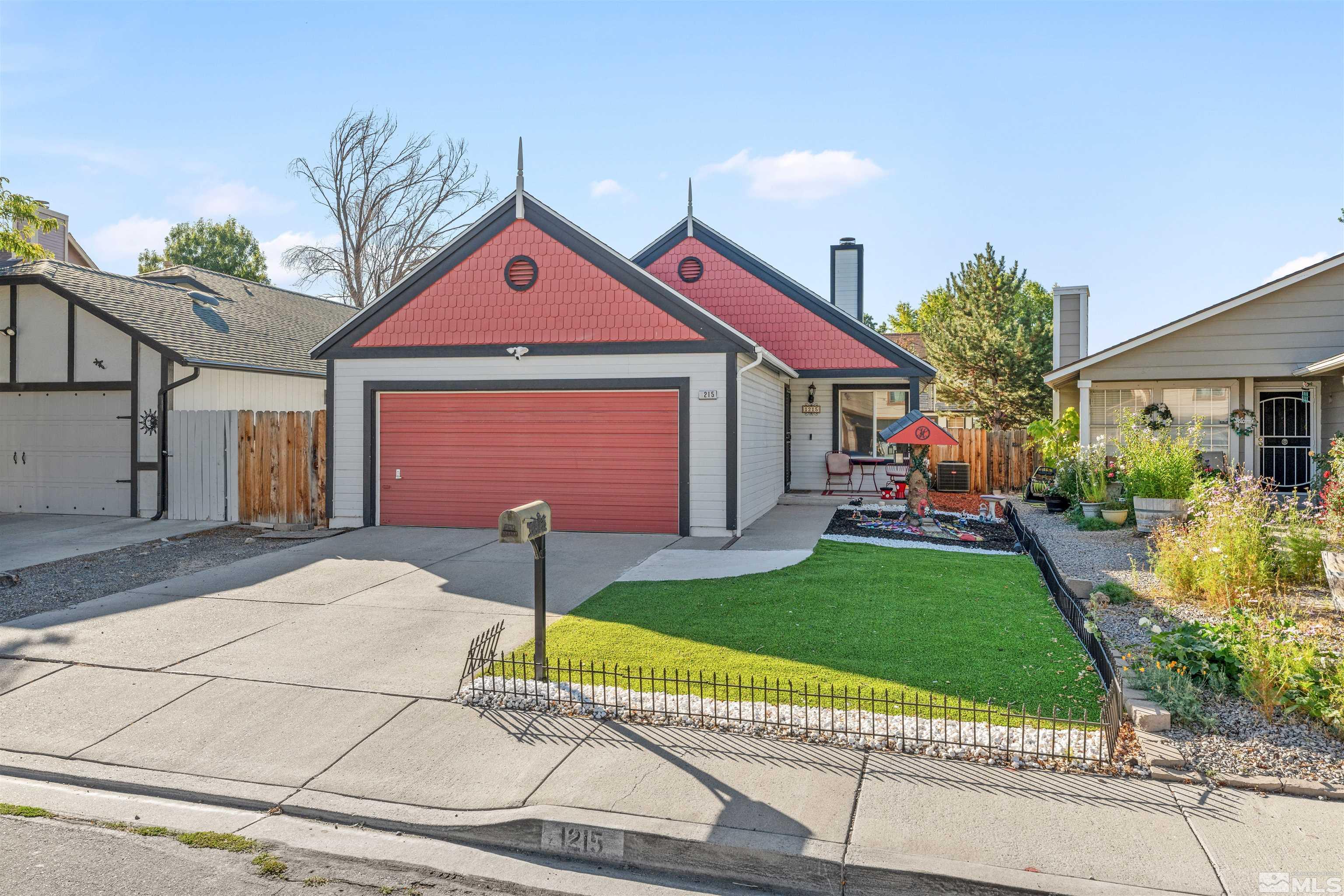 a front view of house with yard and outdoor seating