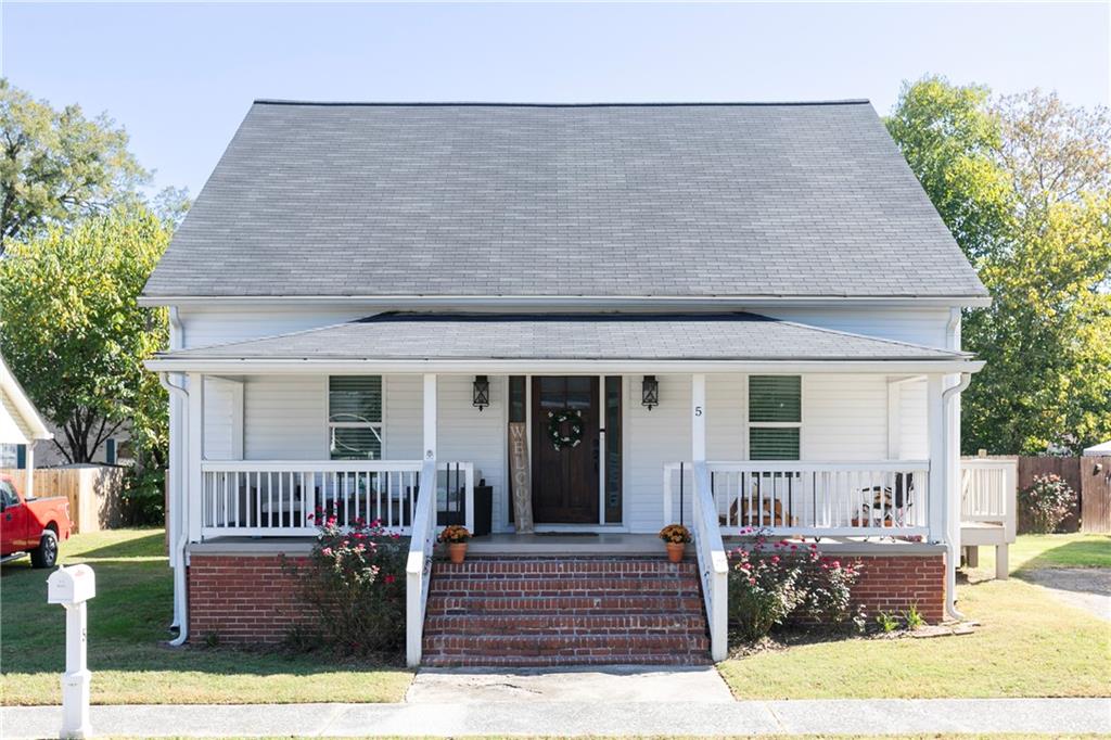 a front view of a house with garage