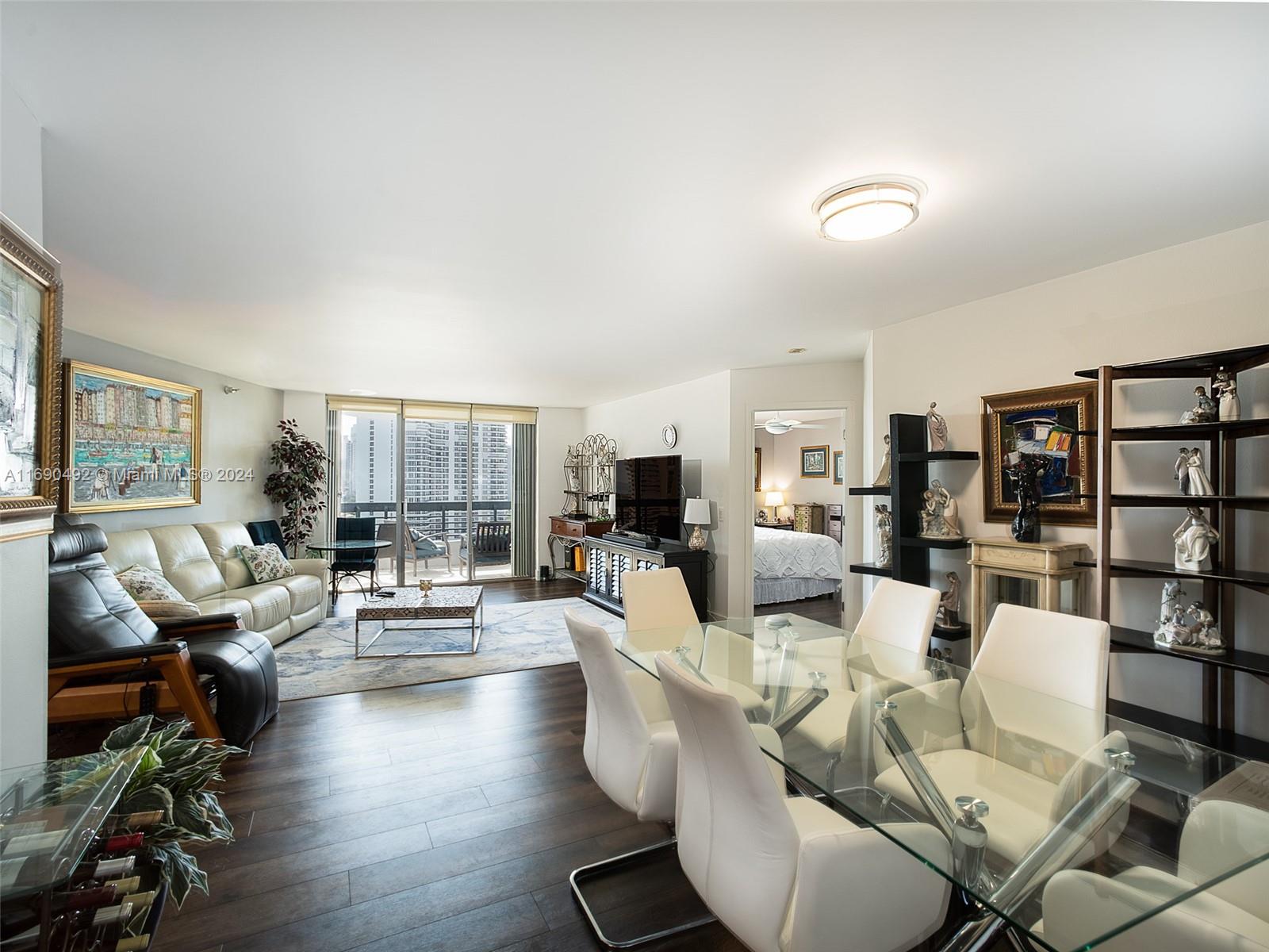 a living room with fireplace furniture and a wooden floor