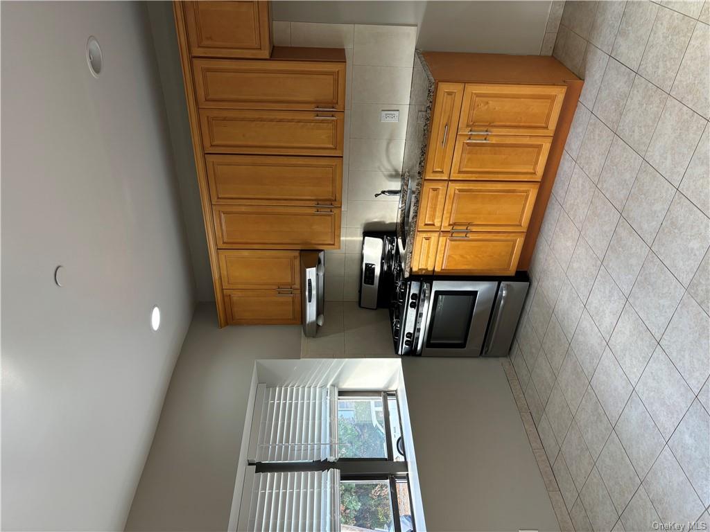 Kitchen featuring countertops, gas range oven,