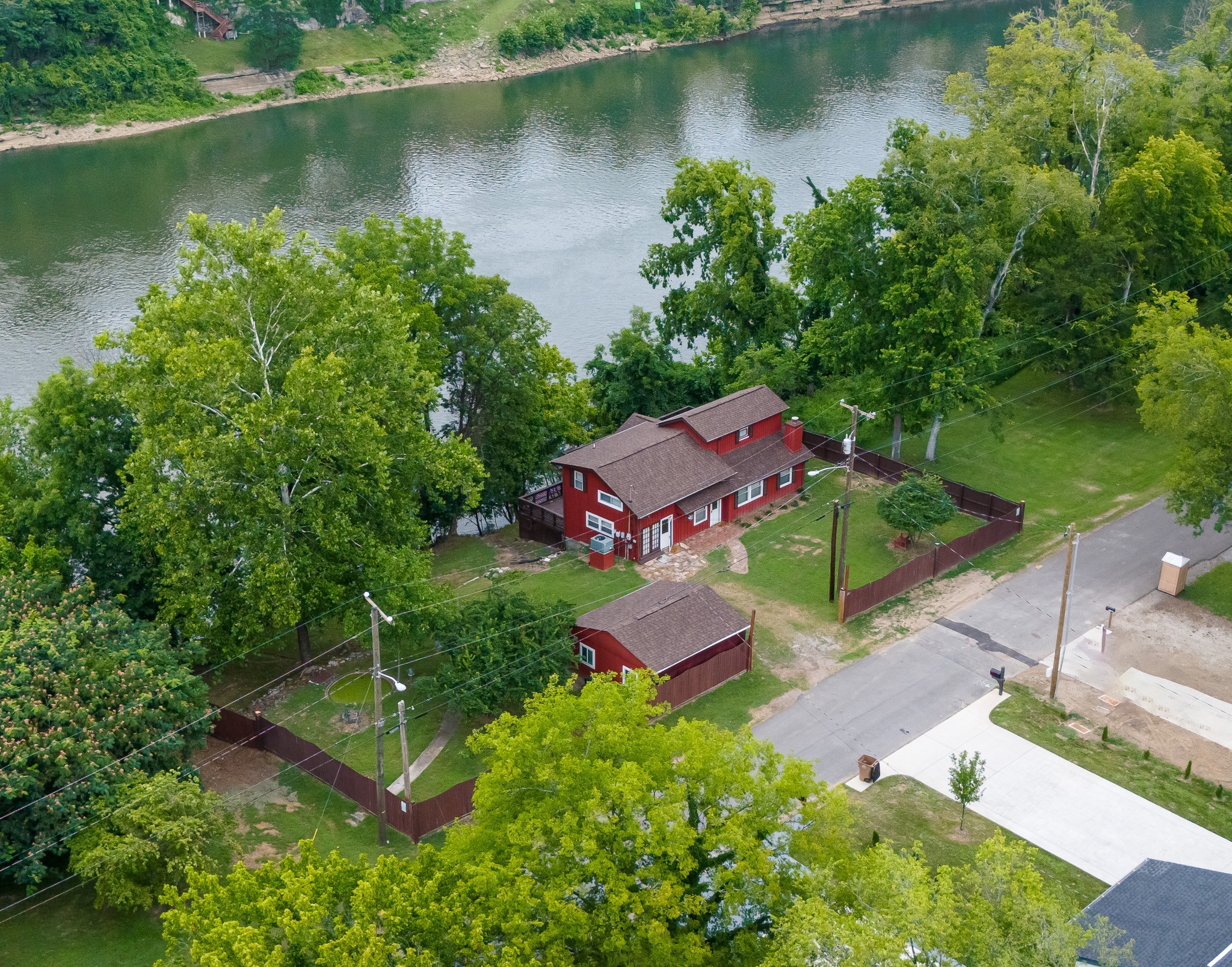 an aerial view of a house with a lake view