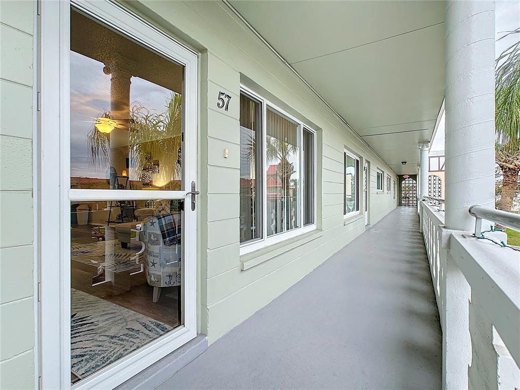 a view of a living room and a balcony