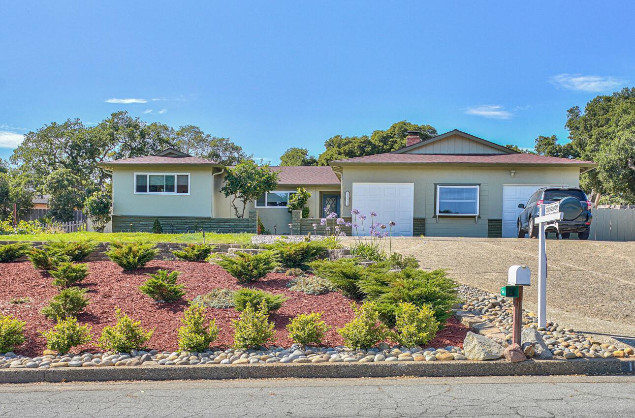 front view of a house with a small yard