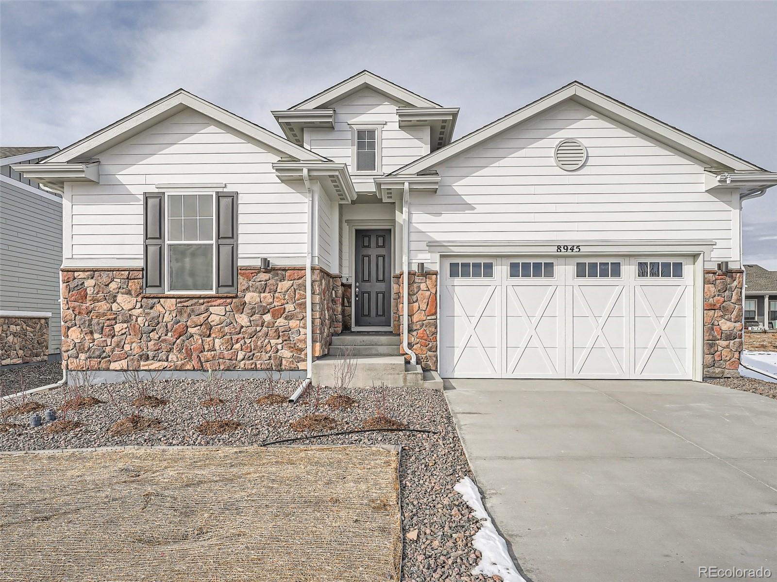 a front view of a house with a garage