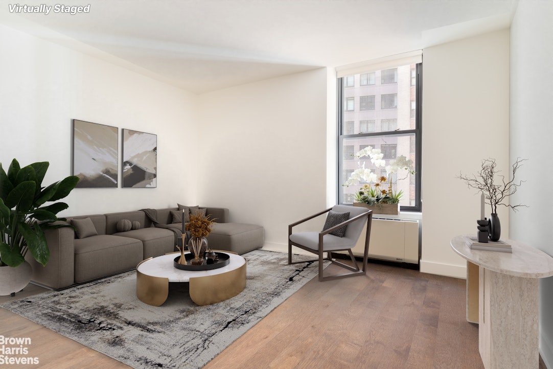 a living room with furniture and a window