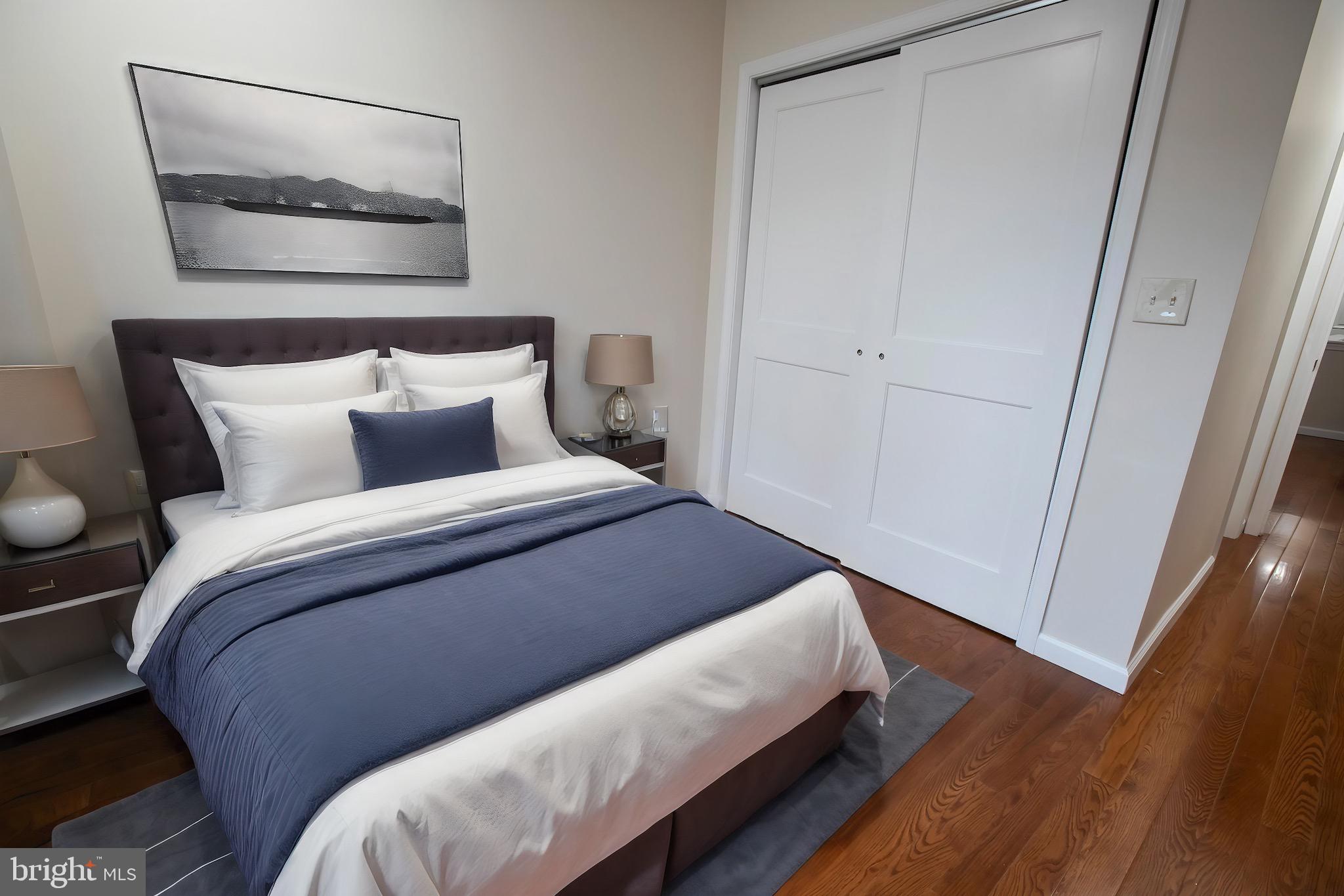 a bedroom with bed and wooden floor