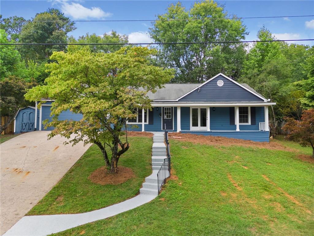 a front view of a house with a yard