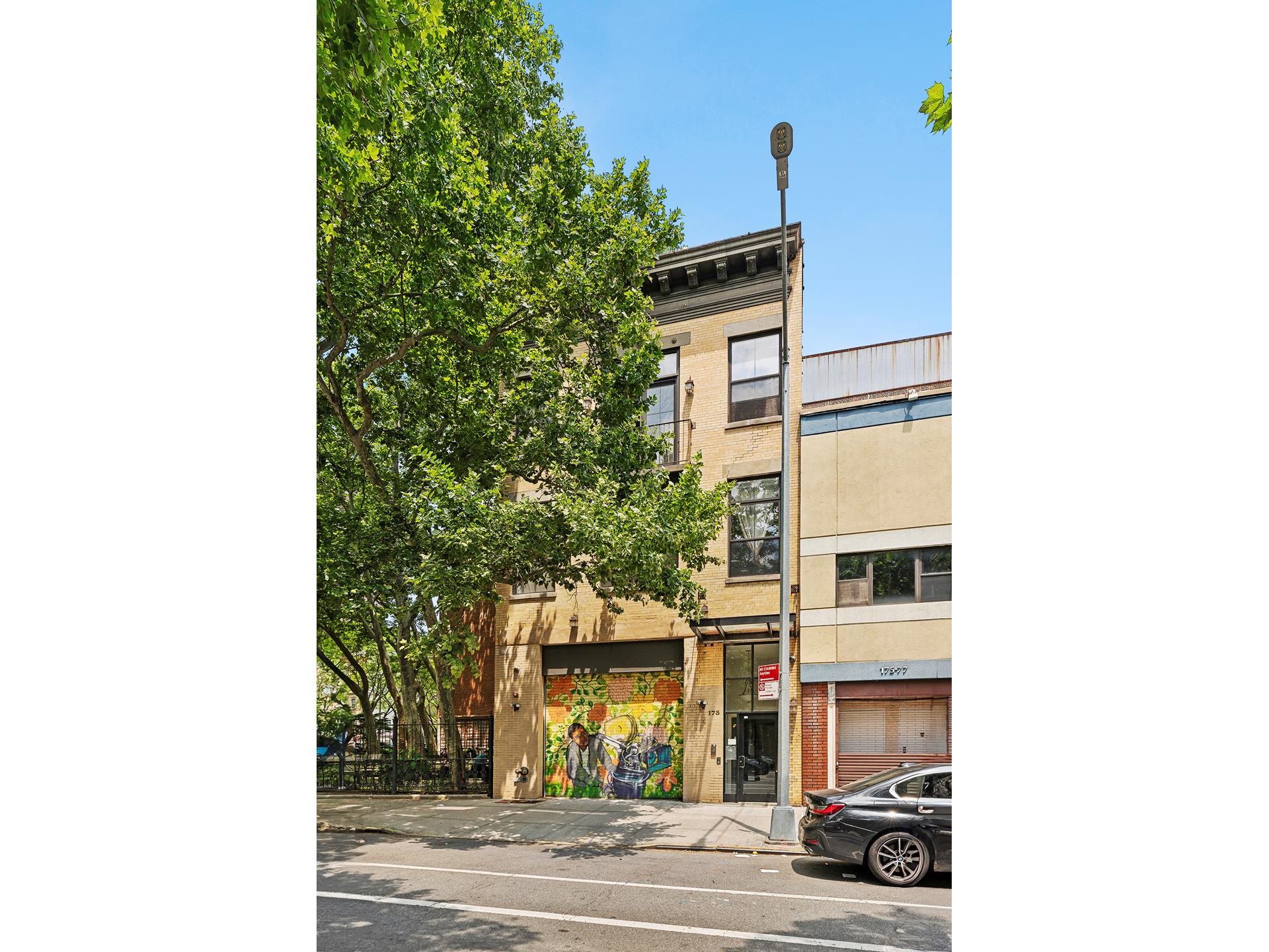 a view of a building with a street