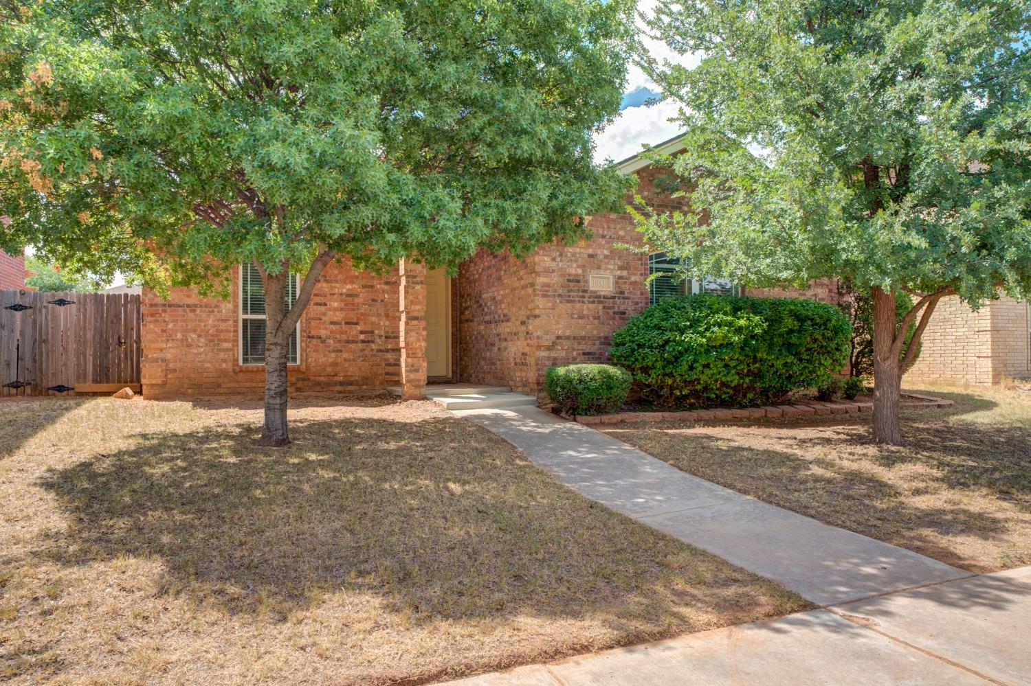 a house with trees in front of it