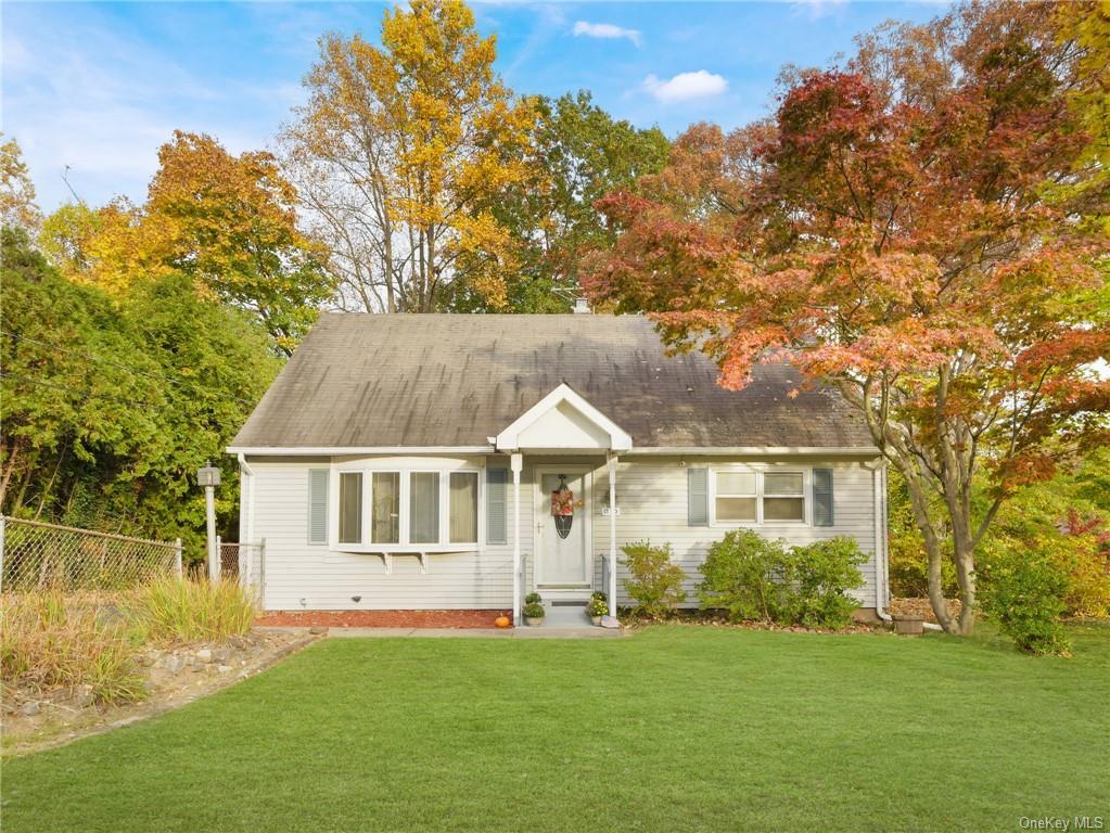 View of front of property featuring a front lawn