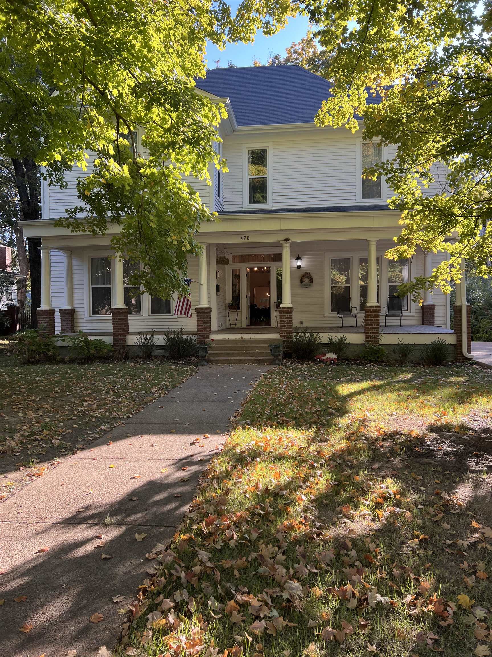 a front view of a house with a yard