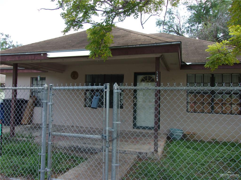 a view of a house with a tree