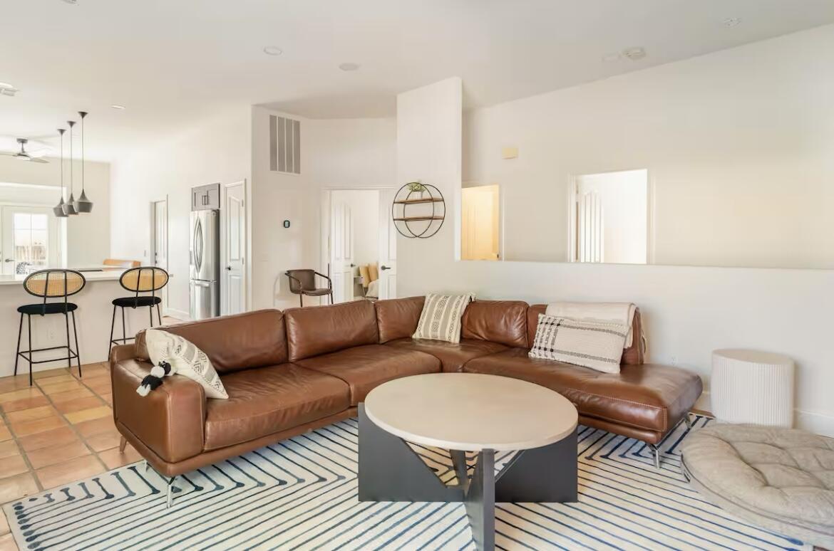 a living room with furniture and a rug