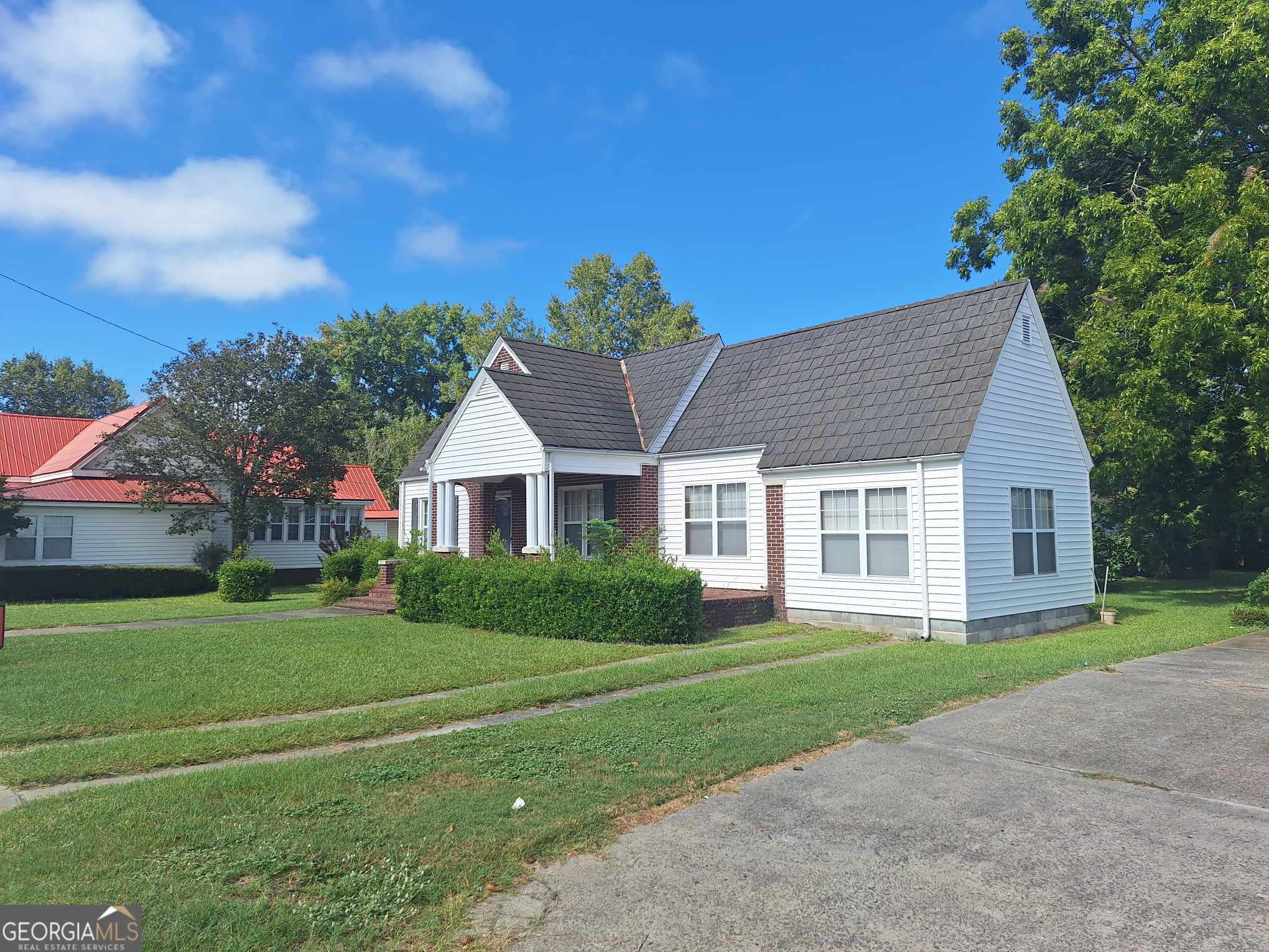 a front view of a house with a yard