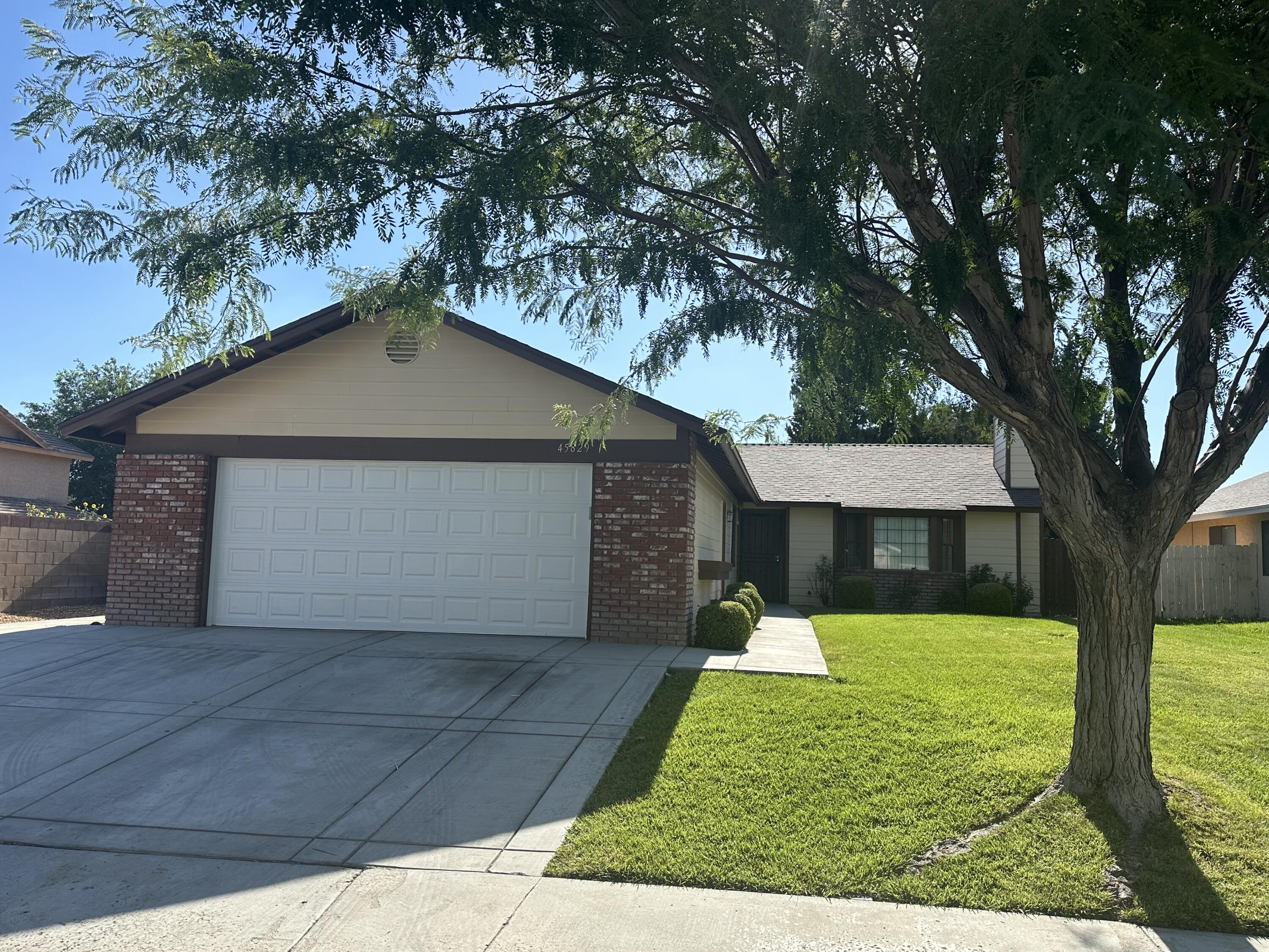 a front view of a house with yard