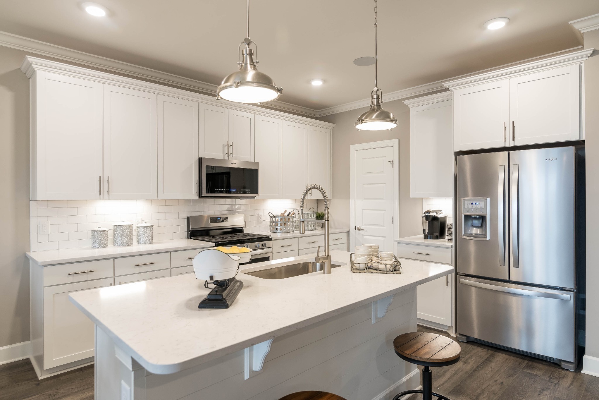 Che's kitchen! This home will feature built in wall oven/microwave with wood hood.