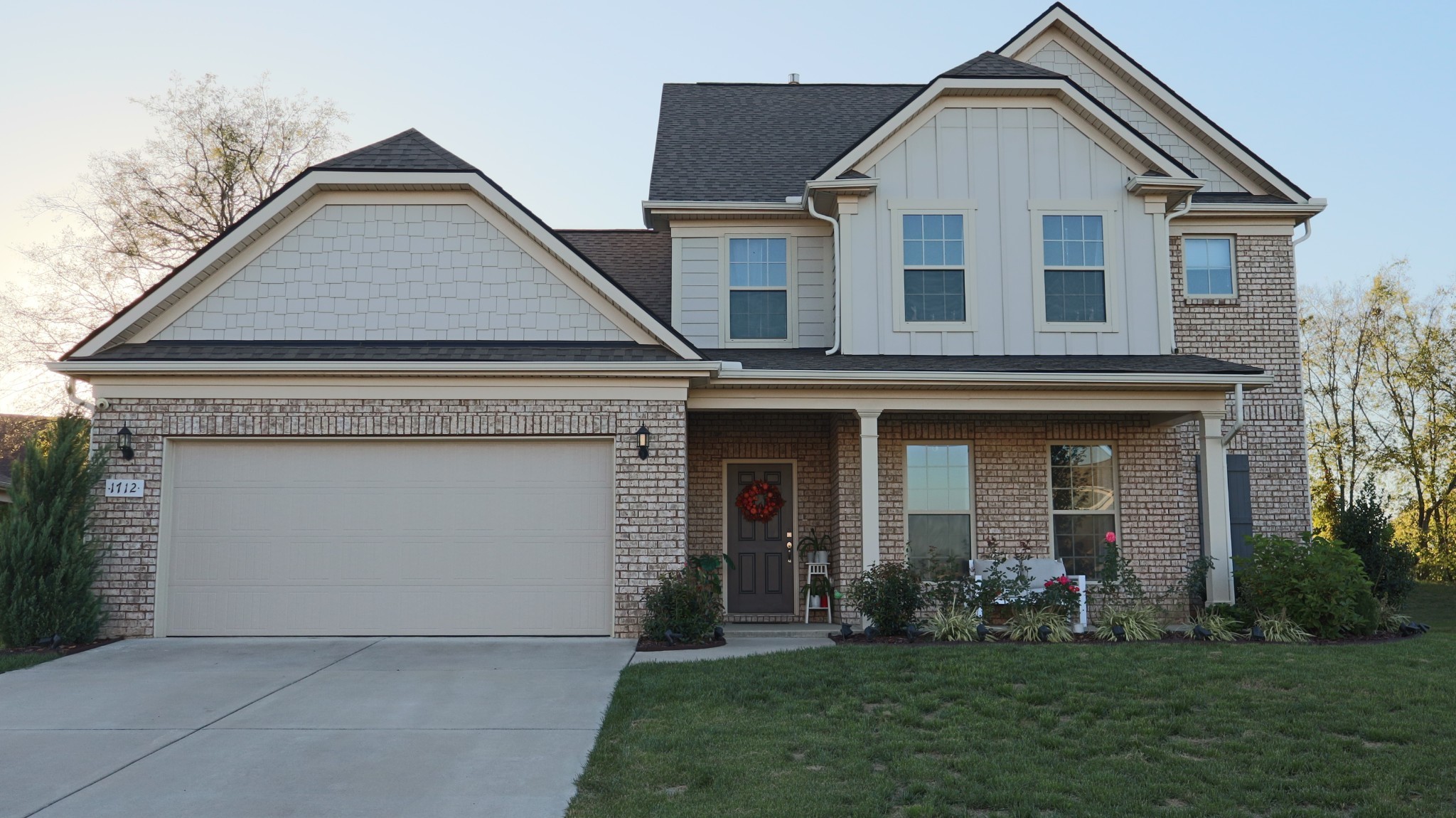 a front view of a house with a yard