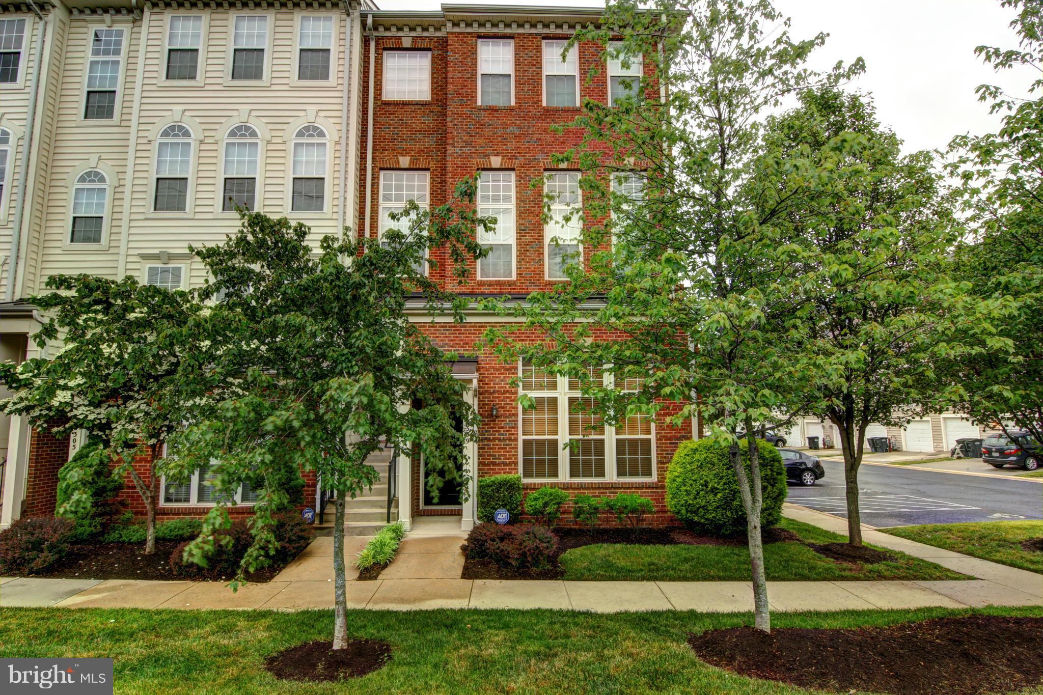 a front view of a building with garden