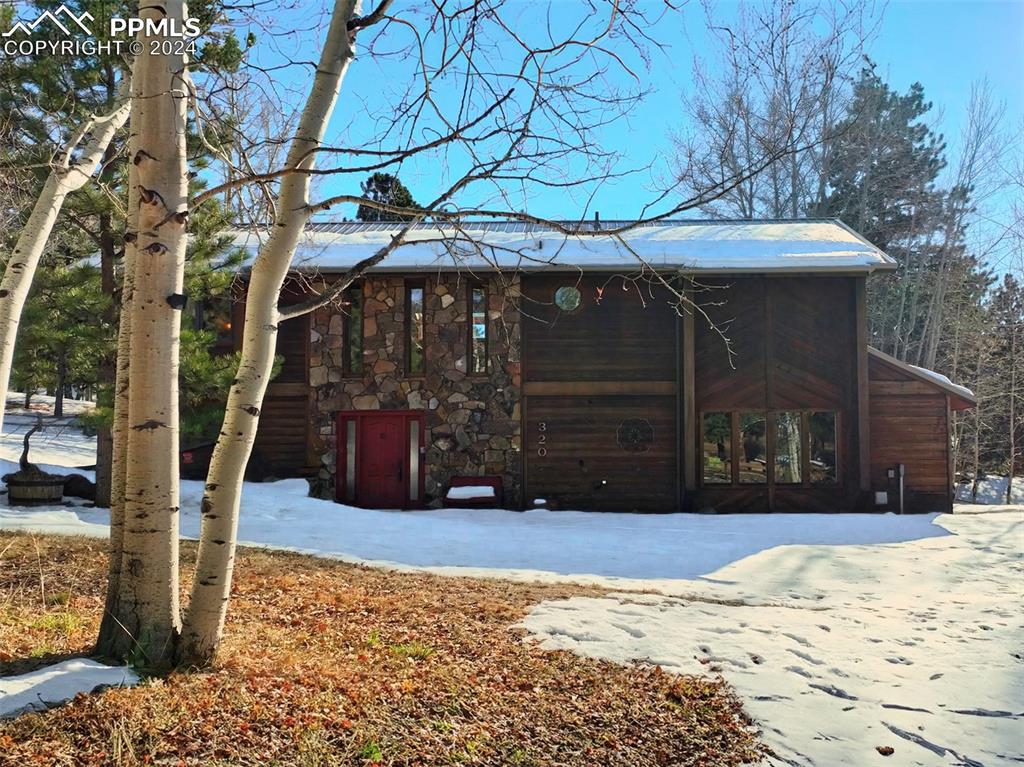 A STUNNING CUSTOM BUILT 3BED/2 AND HALF BATH HOME----showcases cedar siding, moss rock, metal roof, and massive 50ft lush aspen trees that surround the home on a gorgeous fully fenced .74 acre lot that feels soooo very serene, comfortable and private...... you just have to see it in person!  A mountain retreat just a few miles from downtown Woodland Park......Book your showing today!