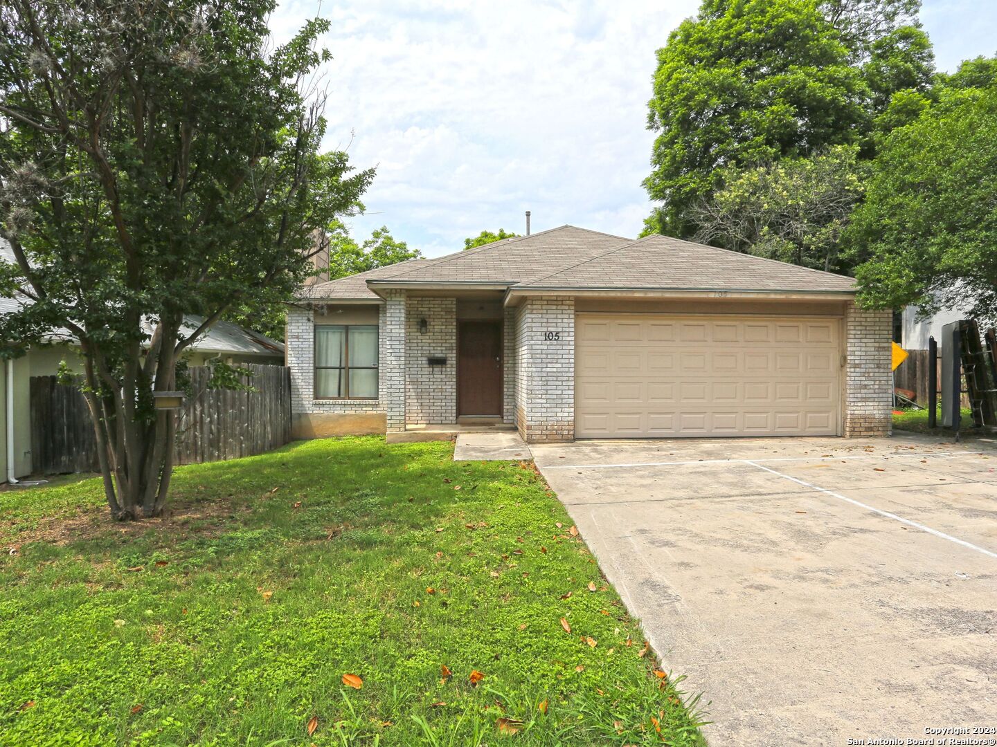 a front view of a house with yard