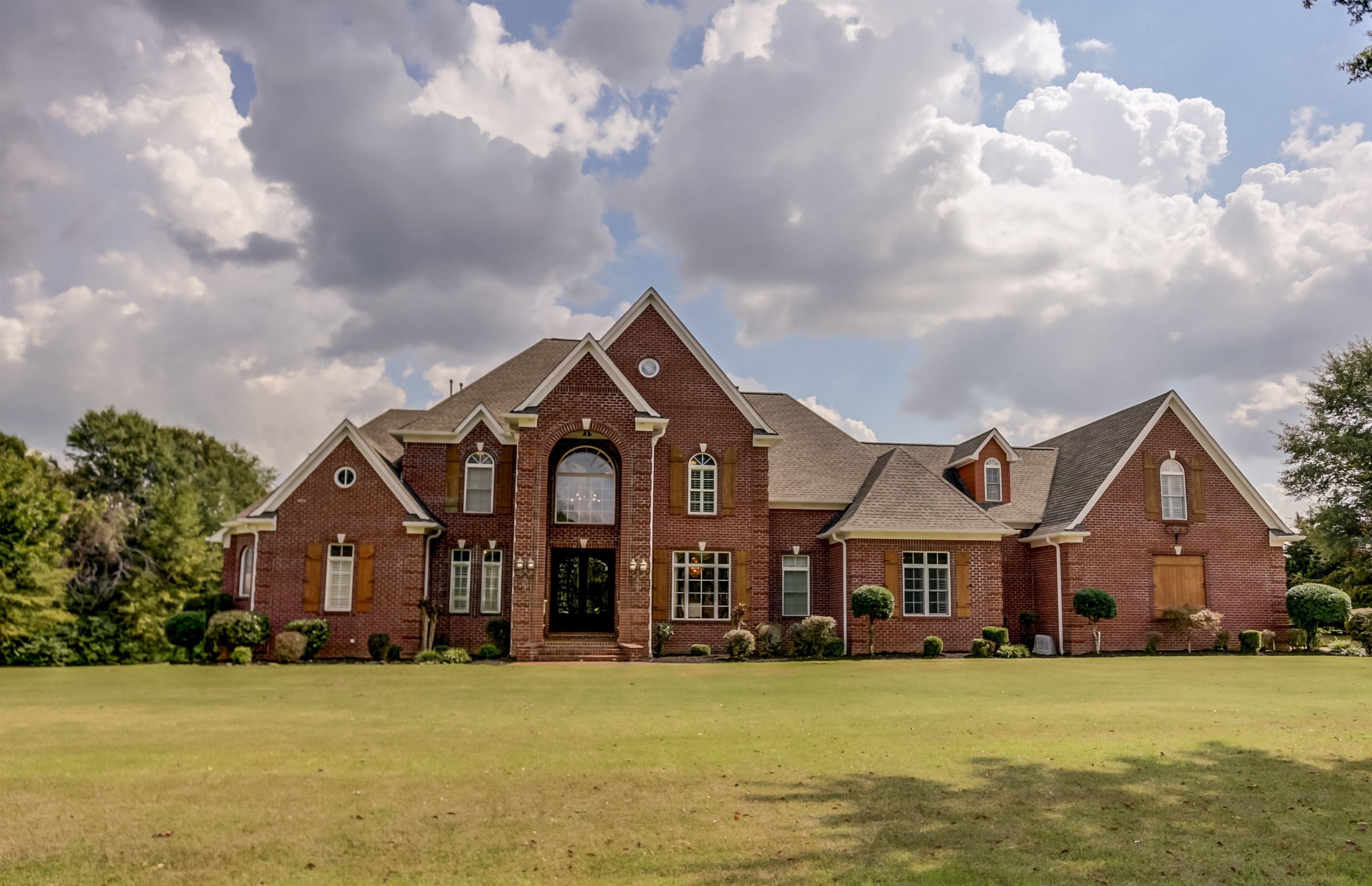 View of property with a front yard