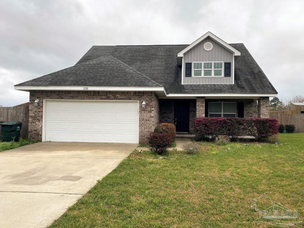 a front view of a house with a yard garage and outdoor seating