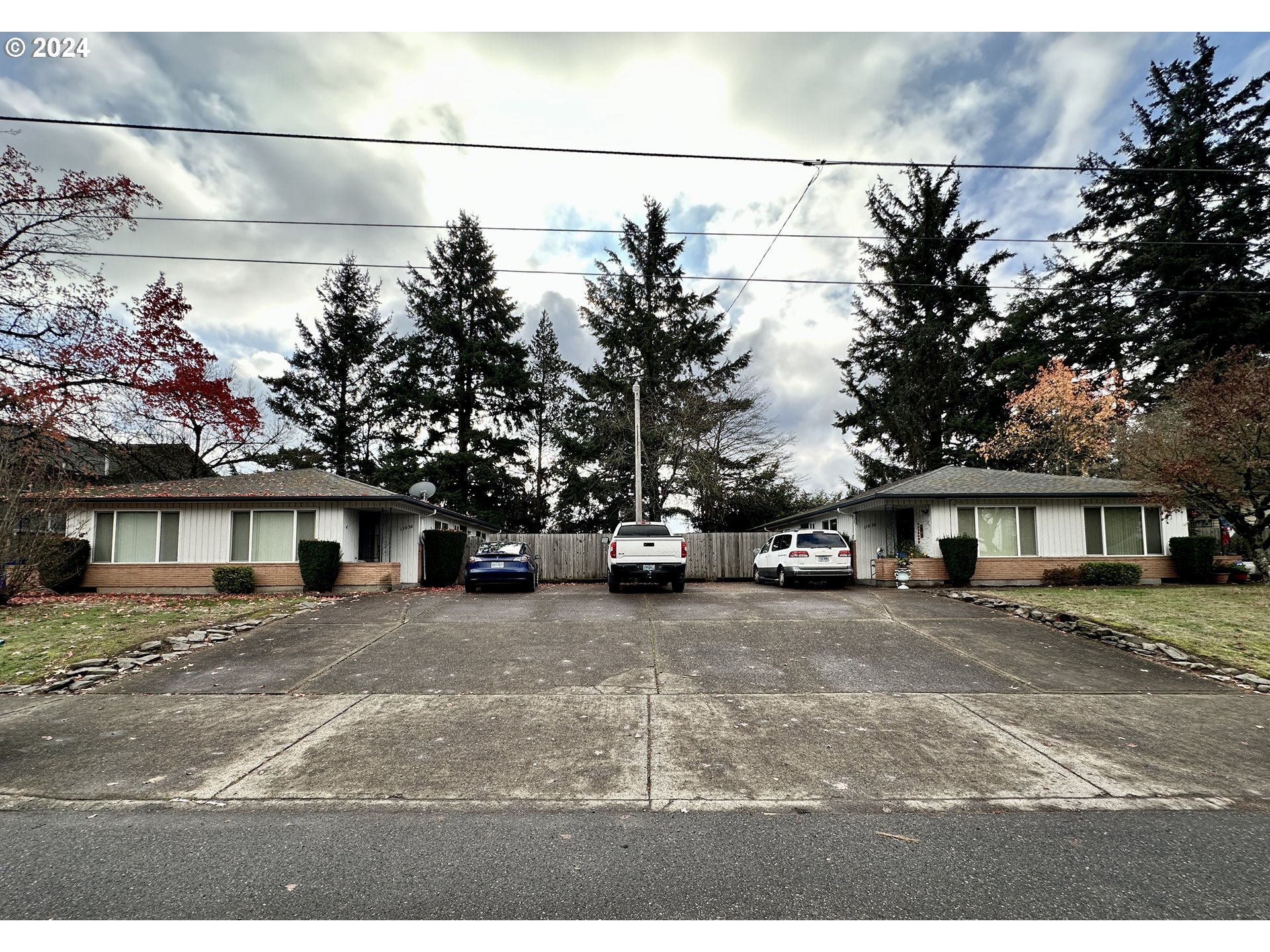 a view of a house with a street