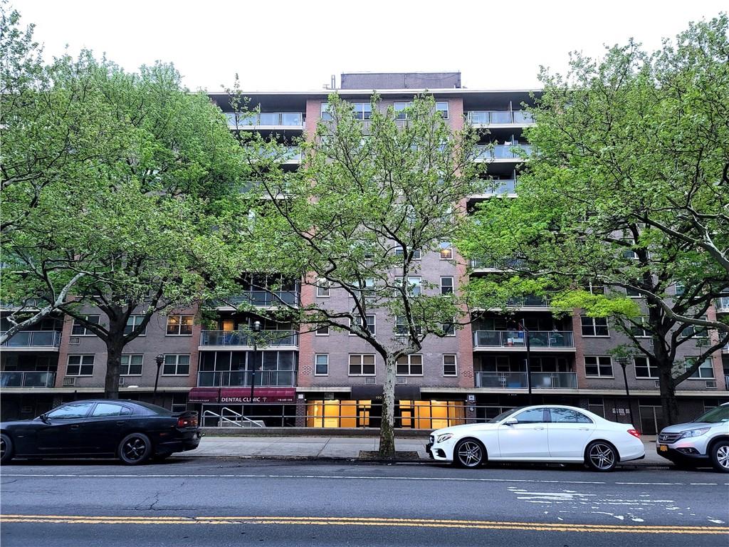 a city street lined with buildings and cars